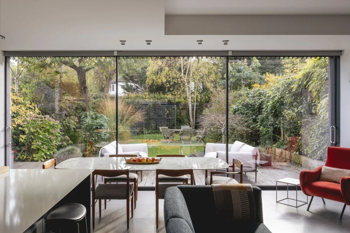 Oak House living room with view to dining area and garden